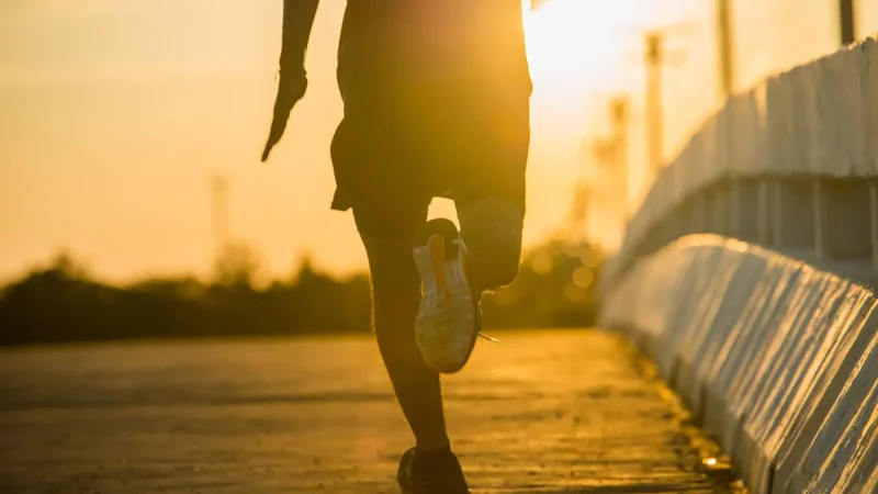 silhouette-young-fitness-man-running-sunrise