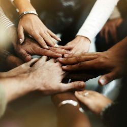 closeup-diverse-people-joining-their-hands